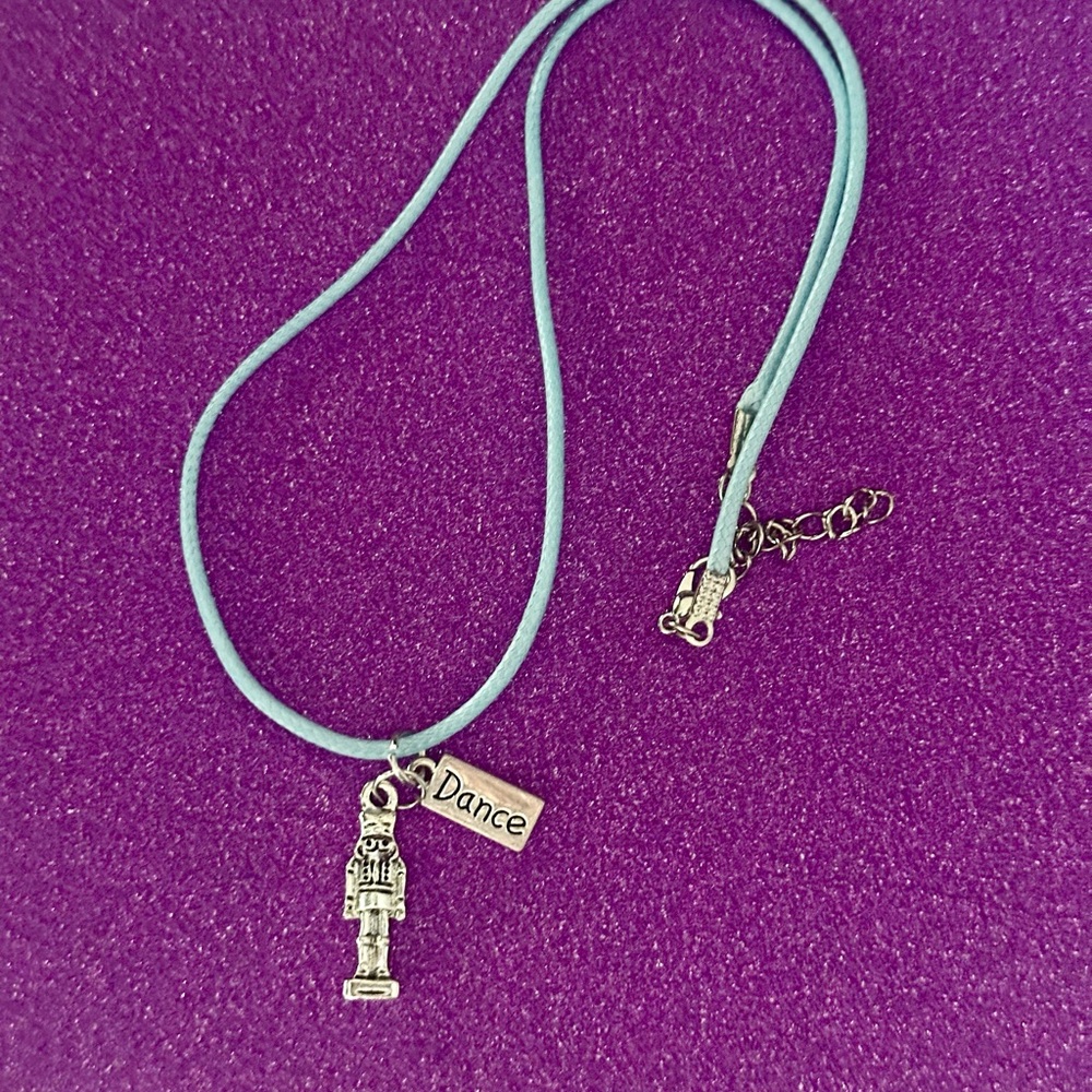 Nutcracker Necklace. Nutcracker and Dance charm with faux leather blue necklace